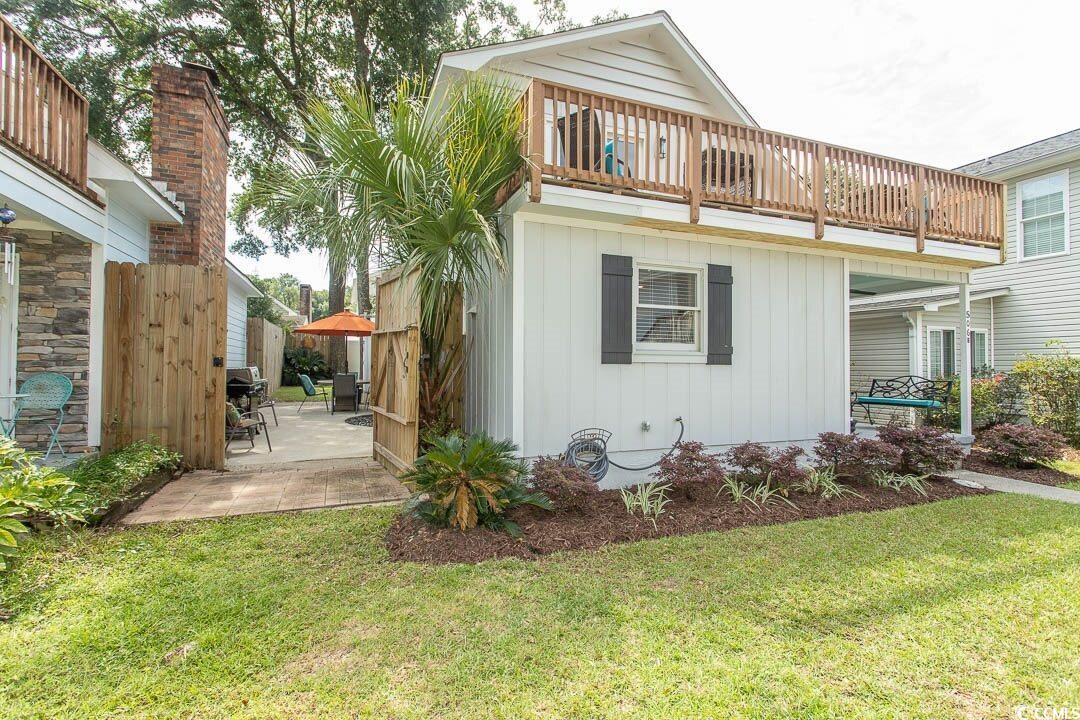 Image 3: Rear view of house featuring a yard, a patio area, Image 3: Rear view of house featuring a yard, a patio area,
