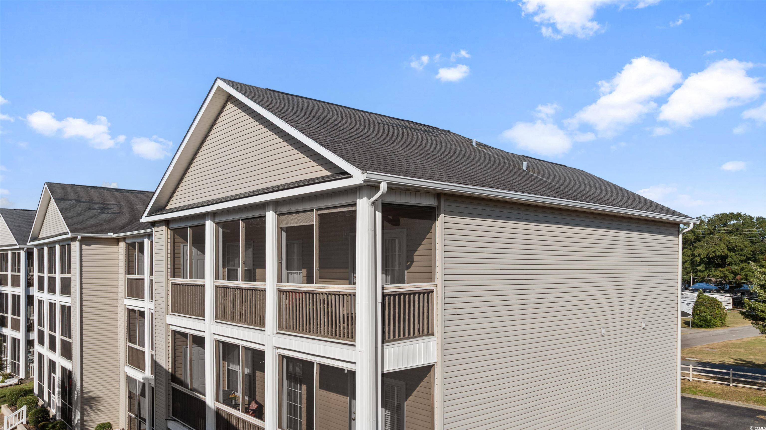 Image 2: View of the condos exterior screen porch from outs Image 2: View of the condos exterior screen porch from outs