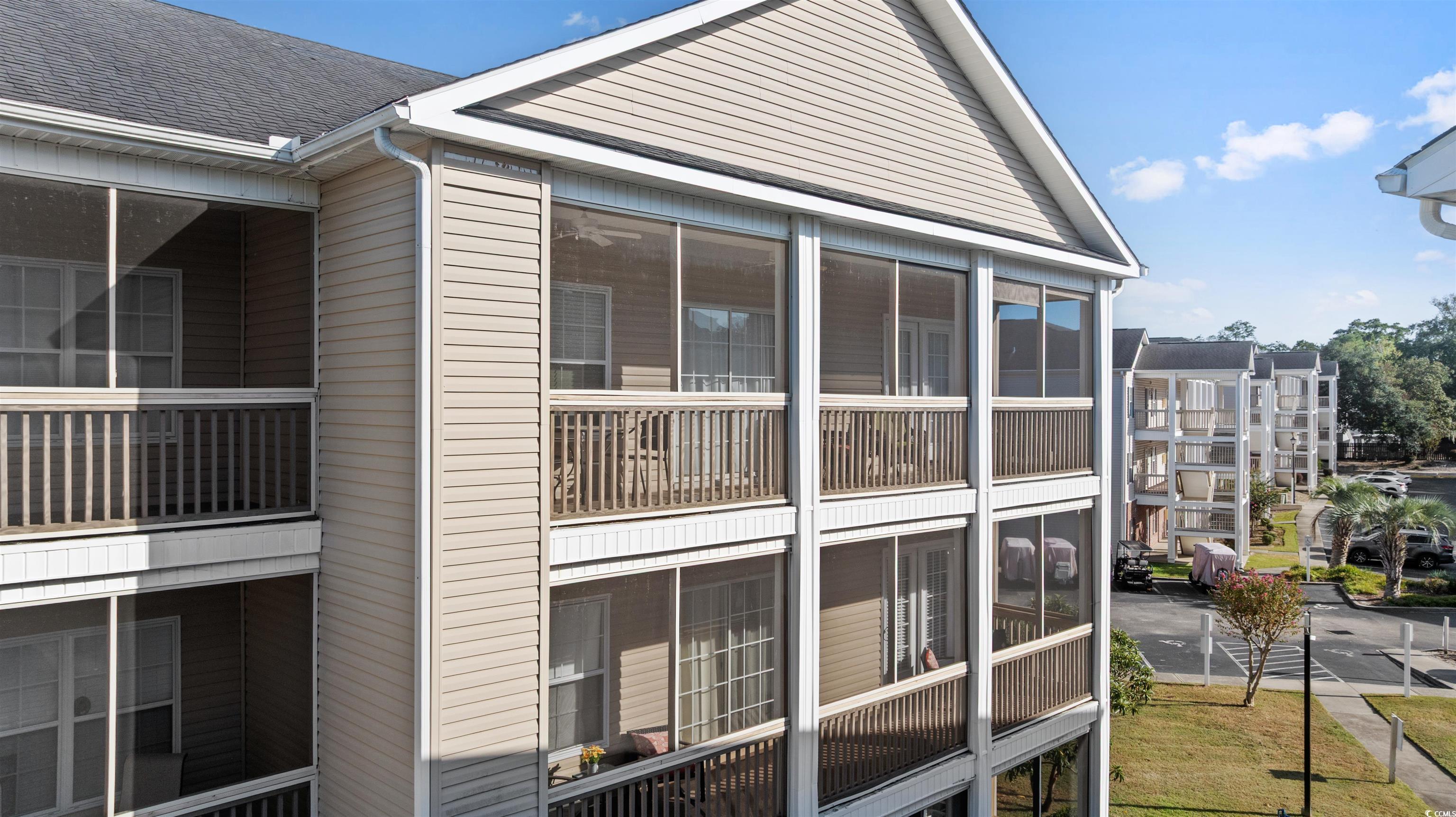 Image 3: View of the condos exterior screen porch from outs Image 3: View of the condos exterior screen porch from outs