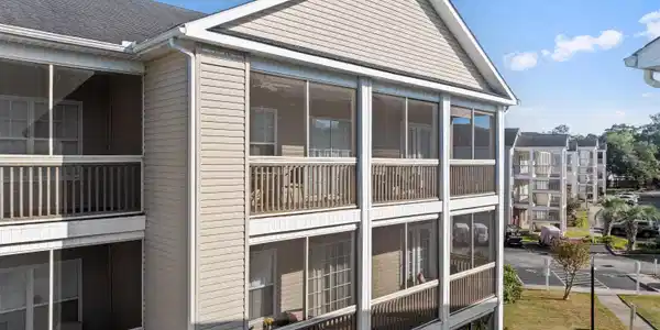 Image 3: View of the condos exterior screen porch from outs
