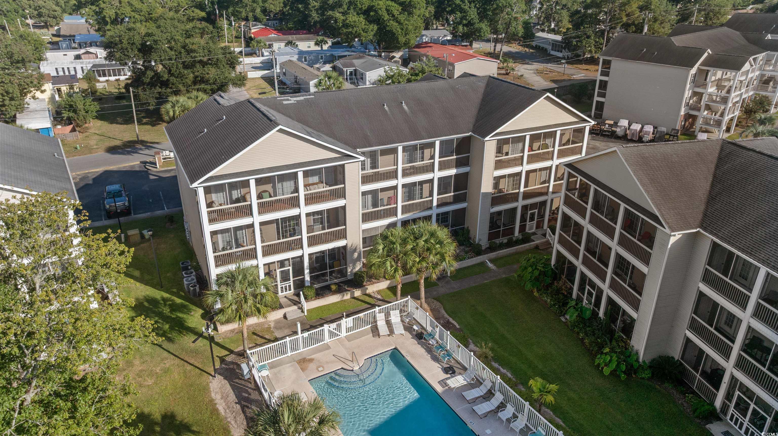 Image 4: Bird's eye view of the building and the pool area Image 4: Bird's eye view of the building and the pool area