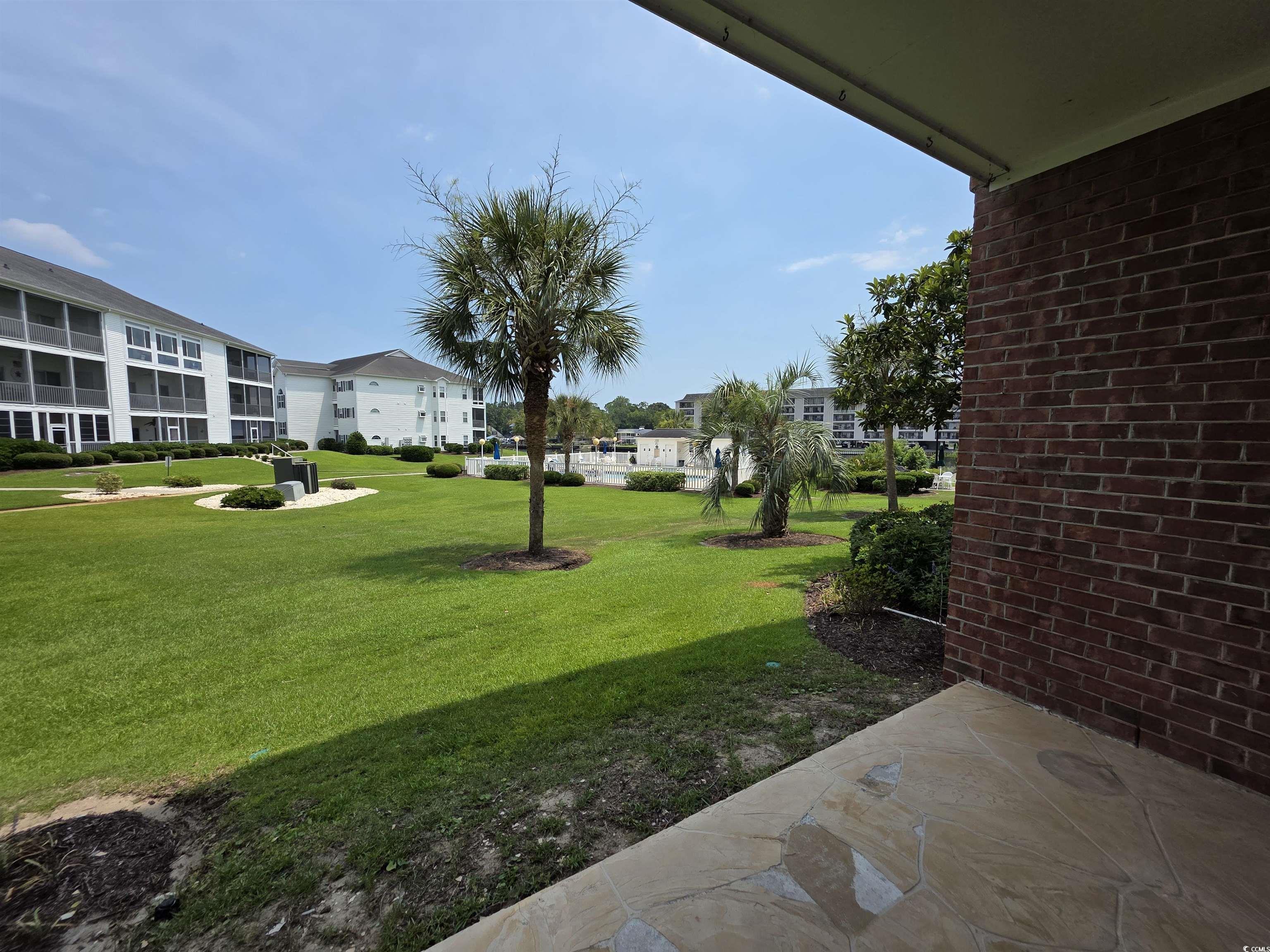 Image 2: View of grassy yard with a residential view Image 2: View of grassy yard with a residential view