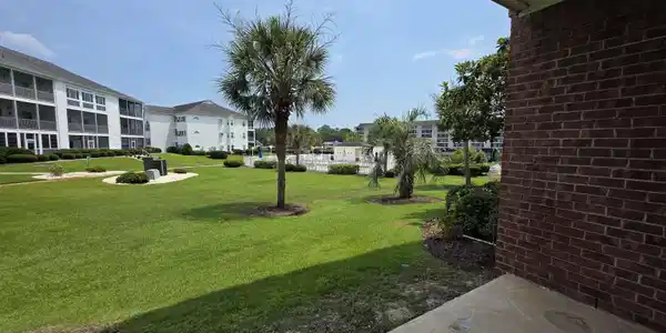 Image 2: View of grassy yard with a residential view Image 2: View of grassy yard with a residential view
