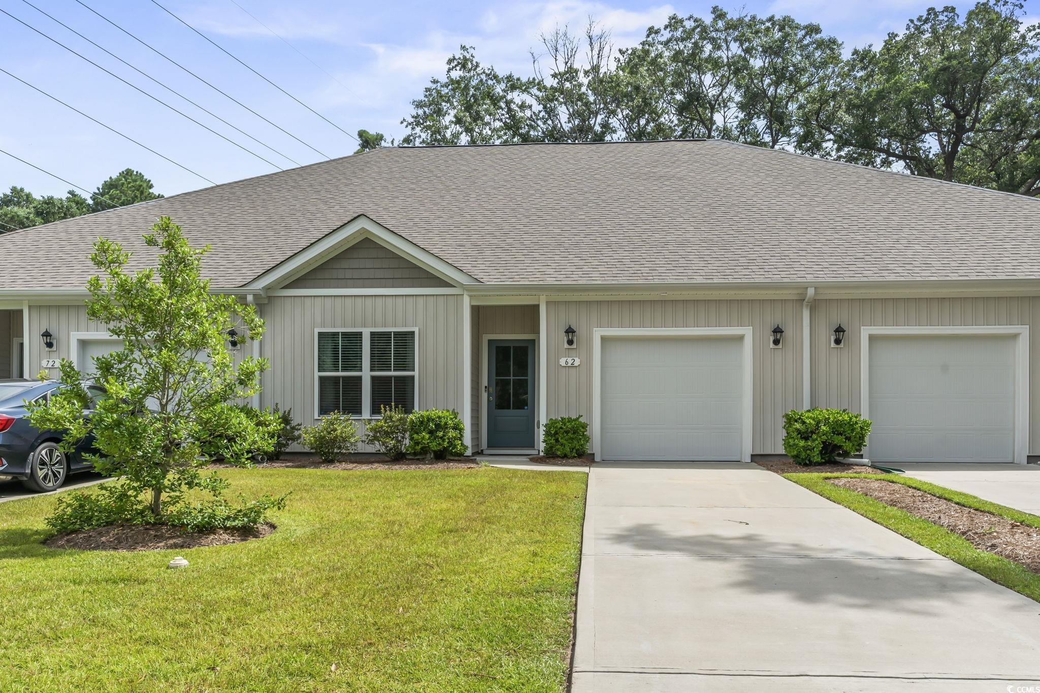 Image 1: View of front of property featuring a shingled roo Image 1: View of front of property featuring a shingled roo