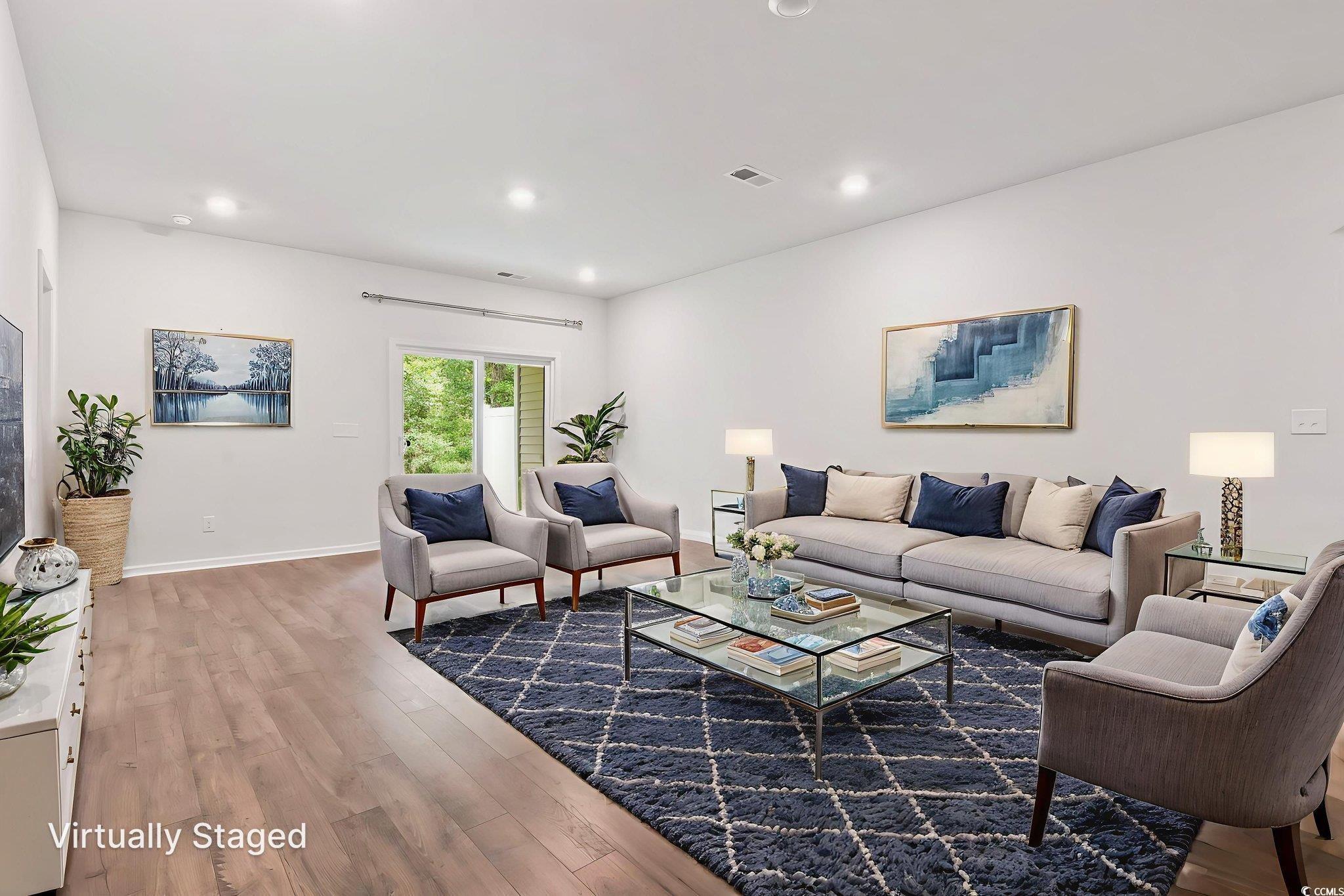 Image 2: Living room featuring wood finished floors and rec Image 2: Living room featuring wood finished floors and rec