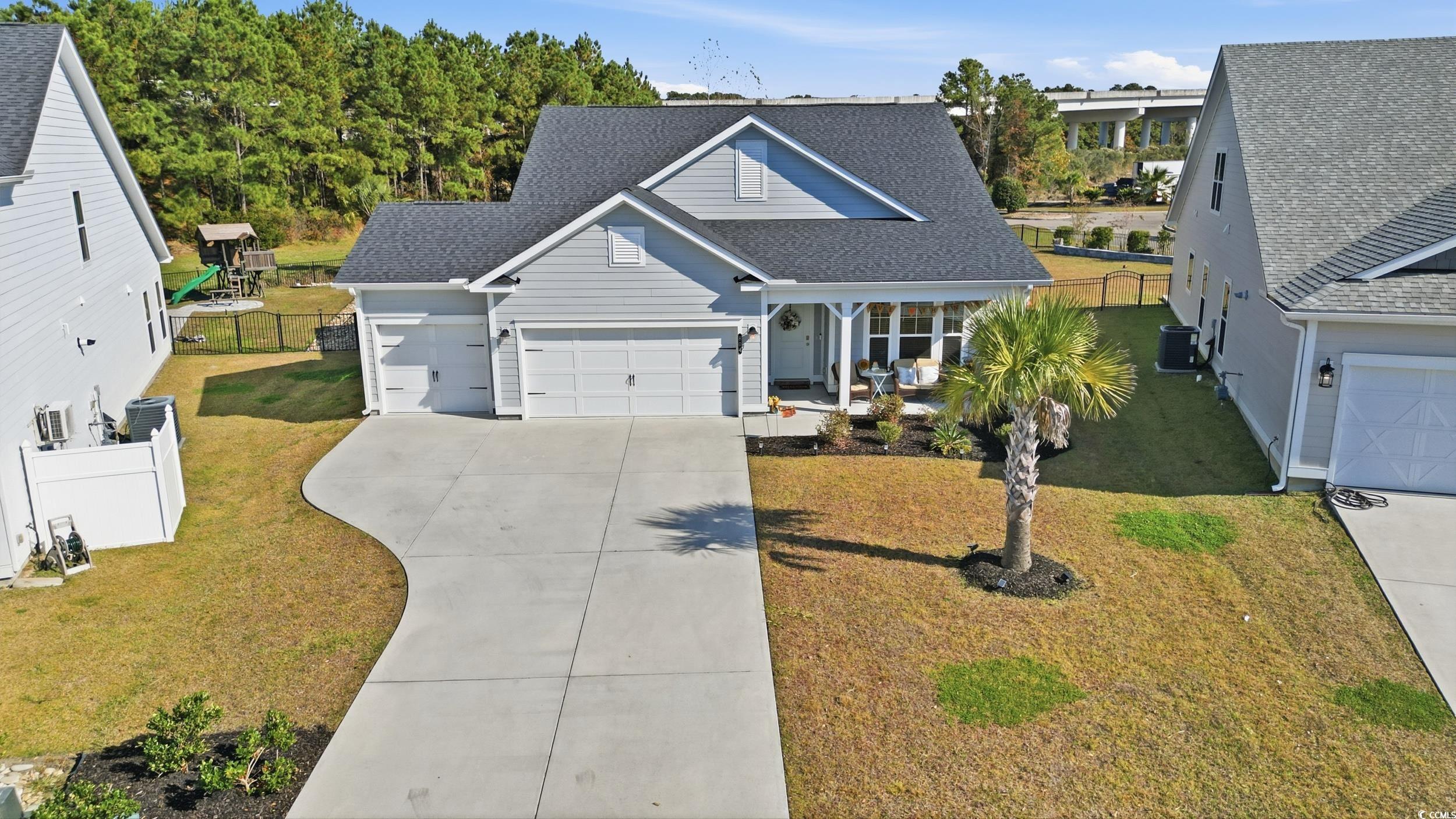 Image 3: Traditional-style home featuring a garage, roof wi Image 3: Traditional-style home featuring a garage, roof wi