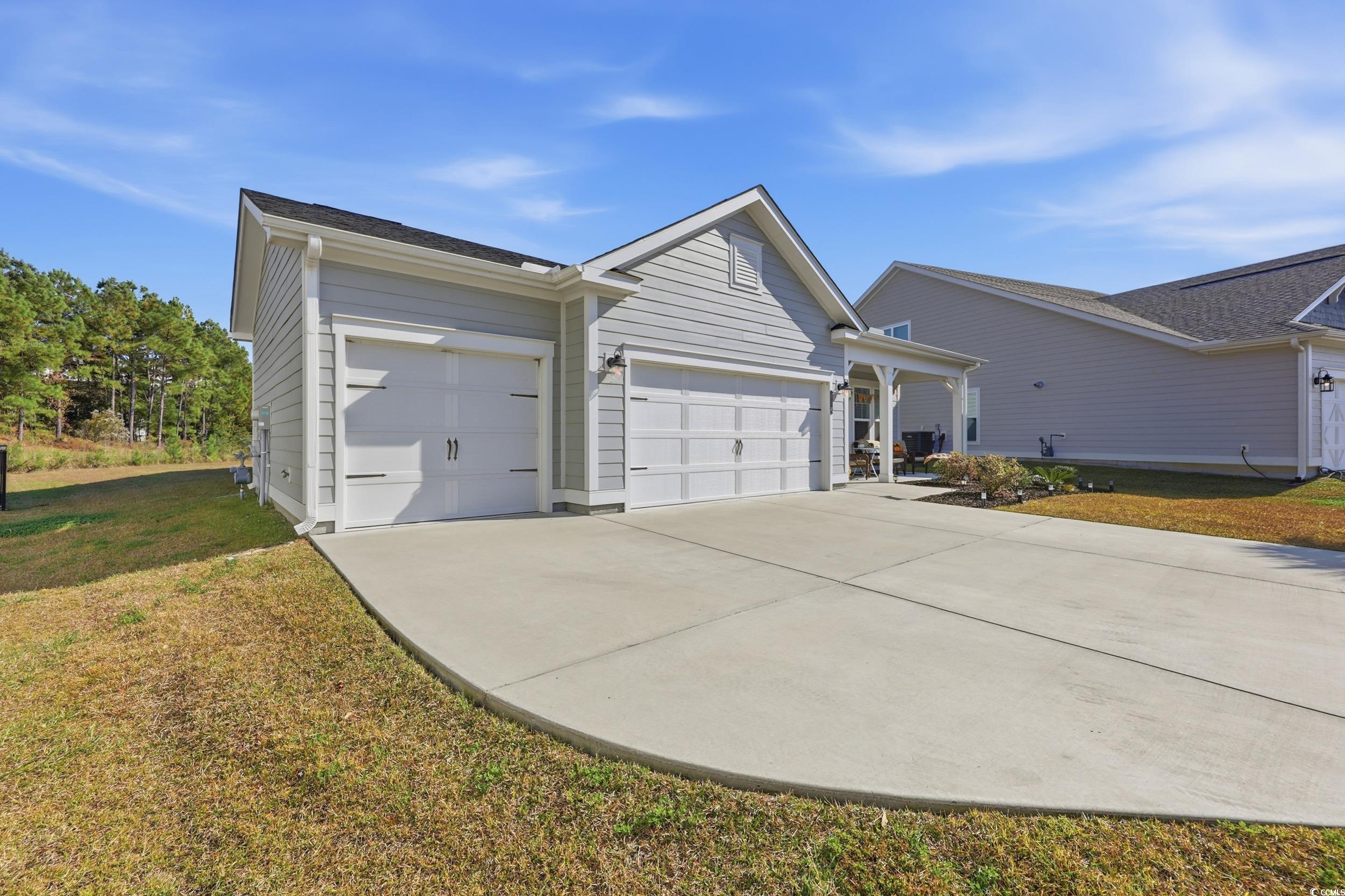 Image 4: View of front of property with a front lawn, concr Image 4: View of front of property with a front lawn, concr