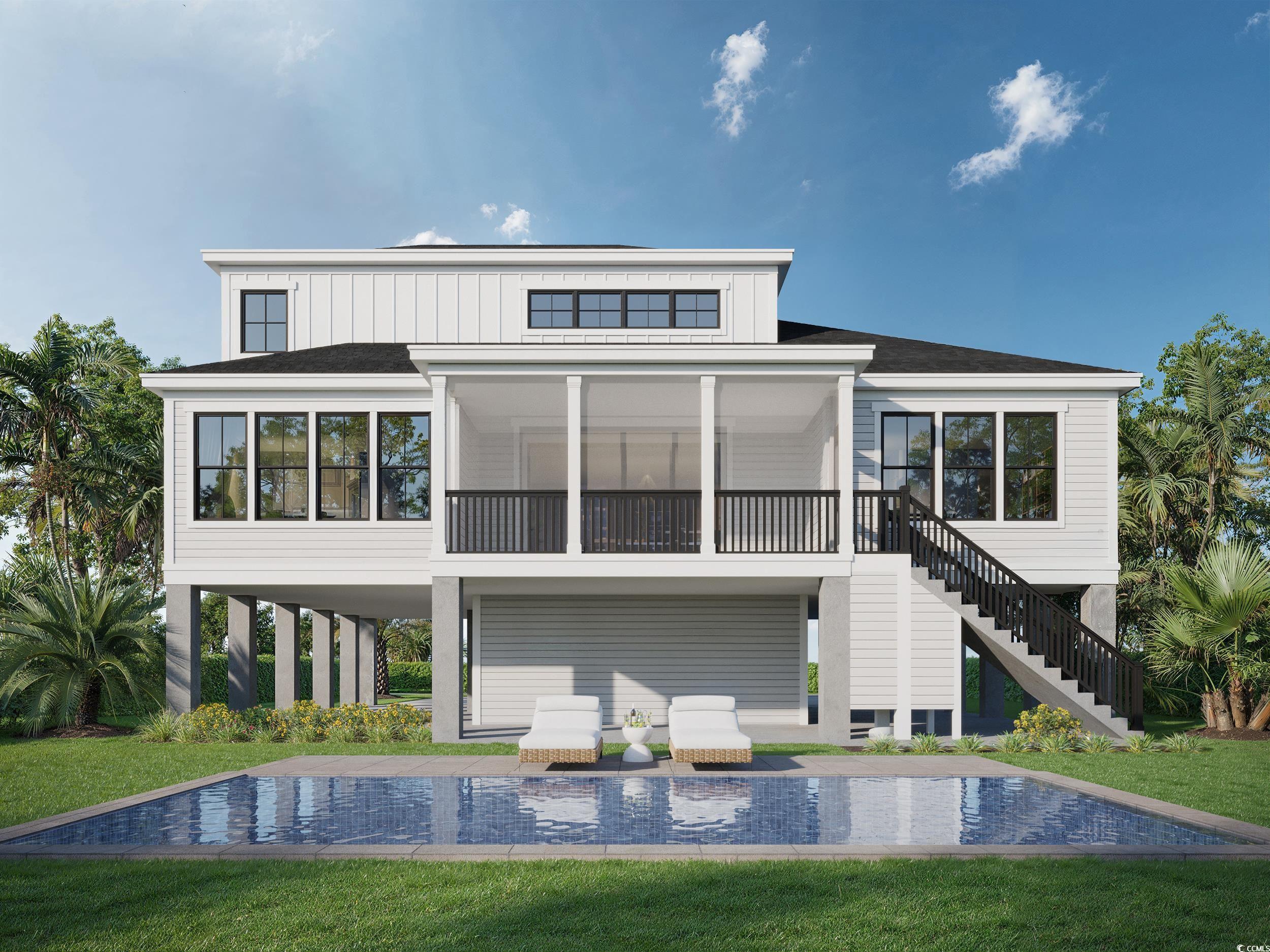 Image 3: Rear view of property with a lawn, a sunroom, a sw