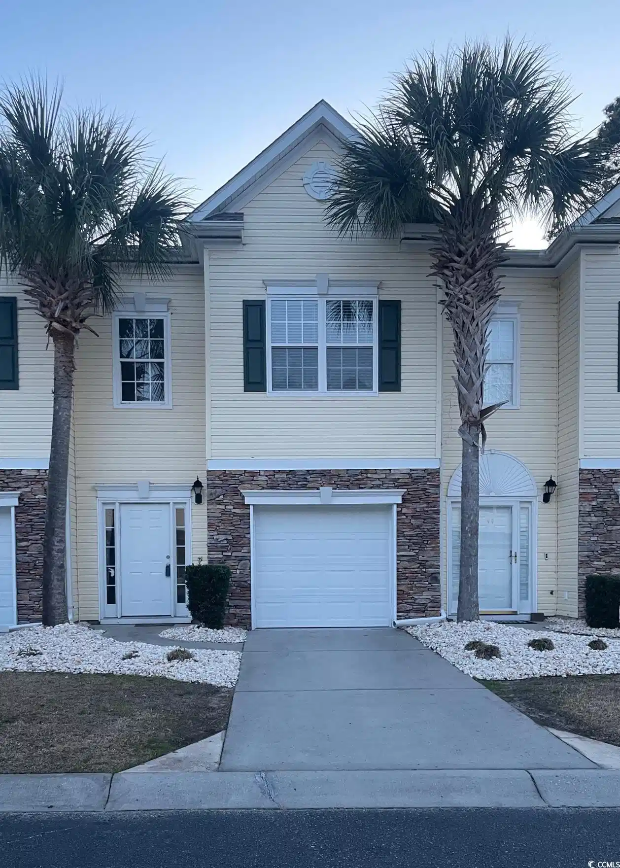 Image 1: View of front of home featuring stone siding, conc Image 1: View of front of home featuring stone siding, conc