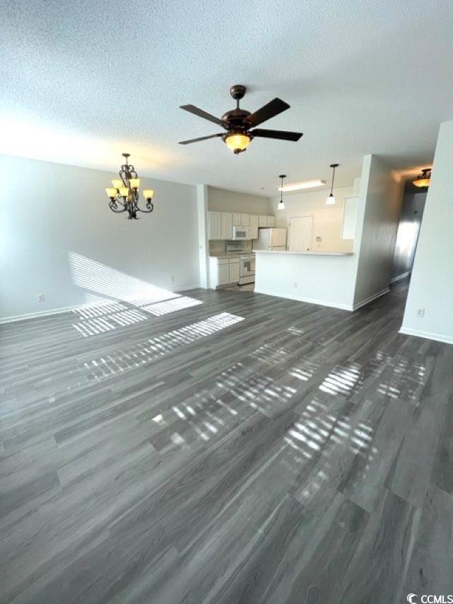 Image 3: Unfurnished living room with a chandelier, ceiling