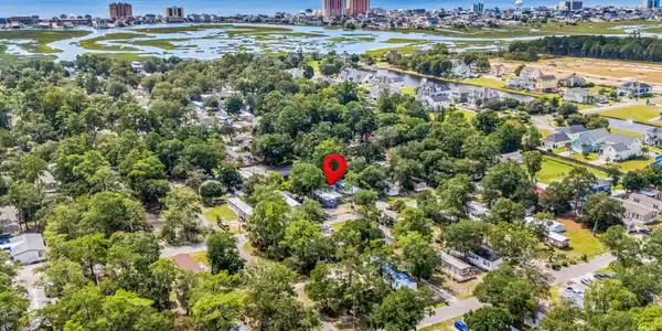 Image 4: Aerial view of residential area featuring a nearby