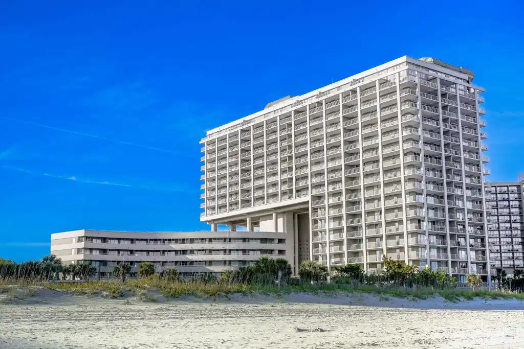 Image 1: View of apartment building / complex