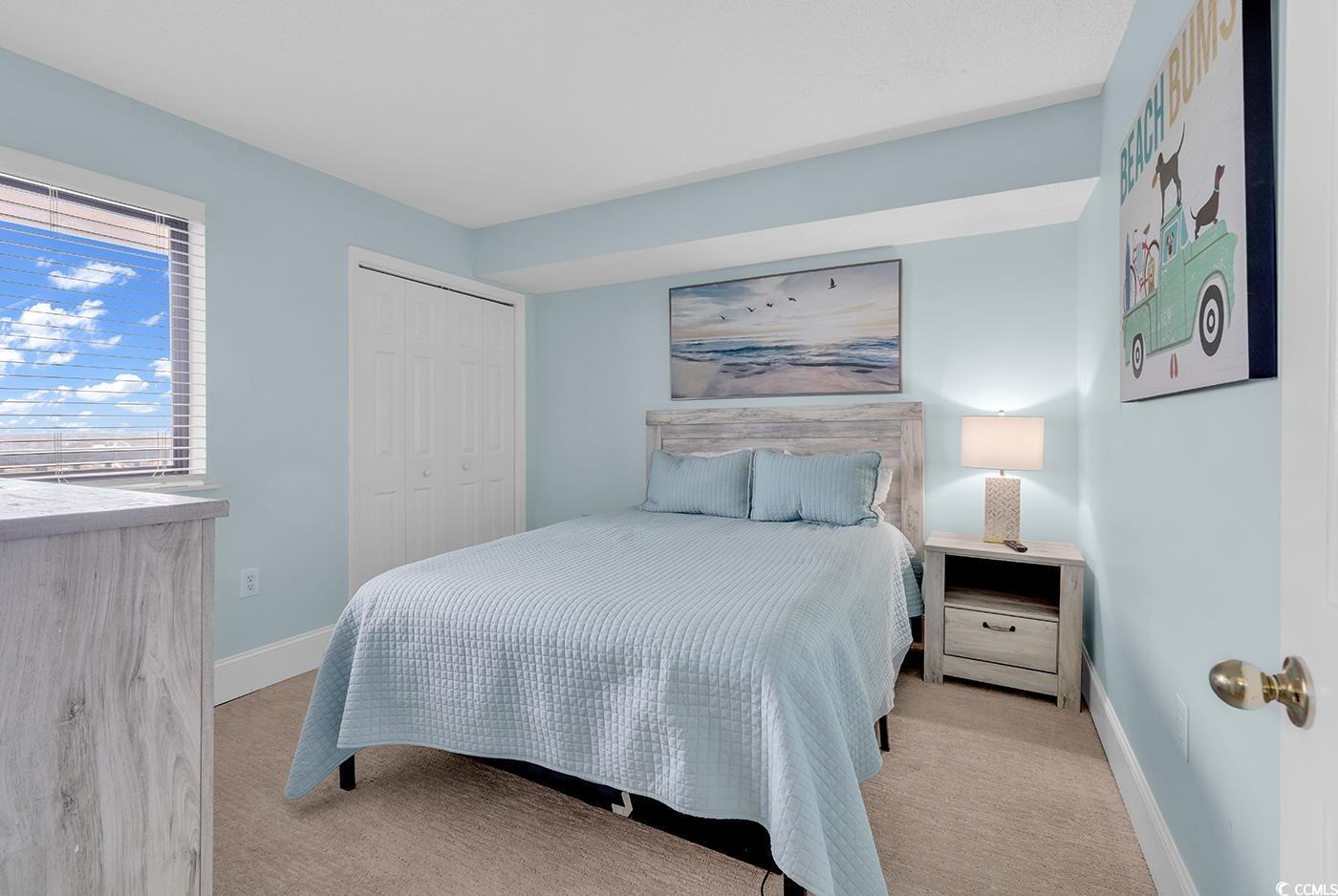 Image 3: Bedroom featuring light carpet and a closet Image 3: Bedroom featuring light carpet and a closet