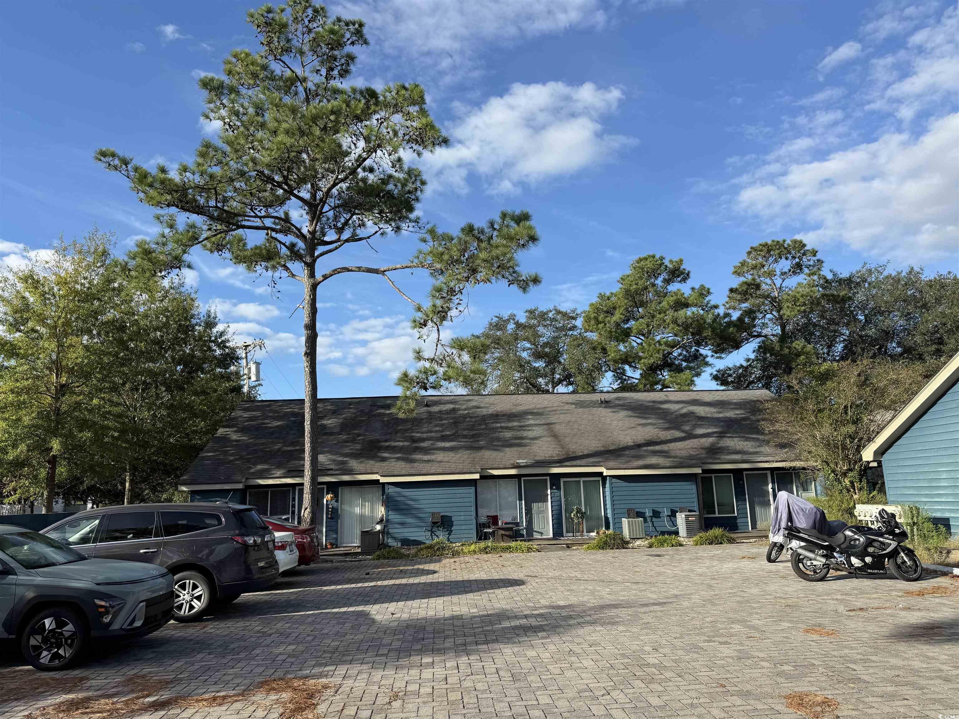 Image 2: View of front facade featuring a shingled roof Image 2: View of front facade featuring a shingled roof