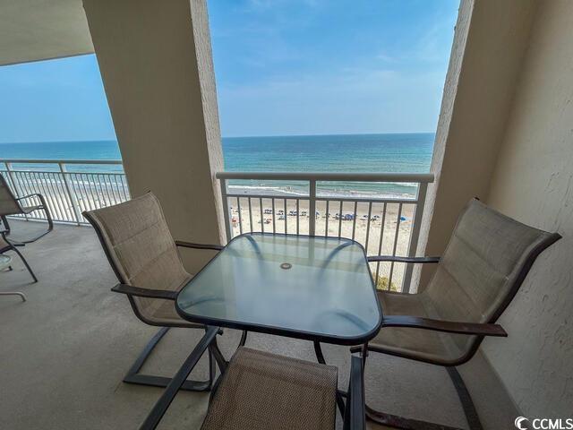 Image 4: Balcony featuring a view of the beach and a water Image 4: Balcony featuring a view of the beach and a water