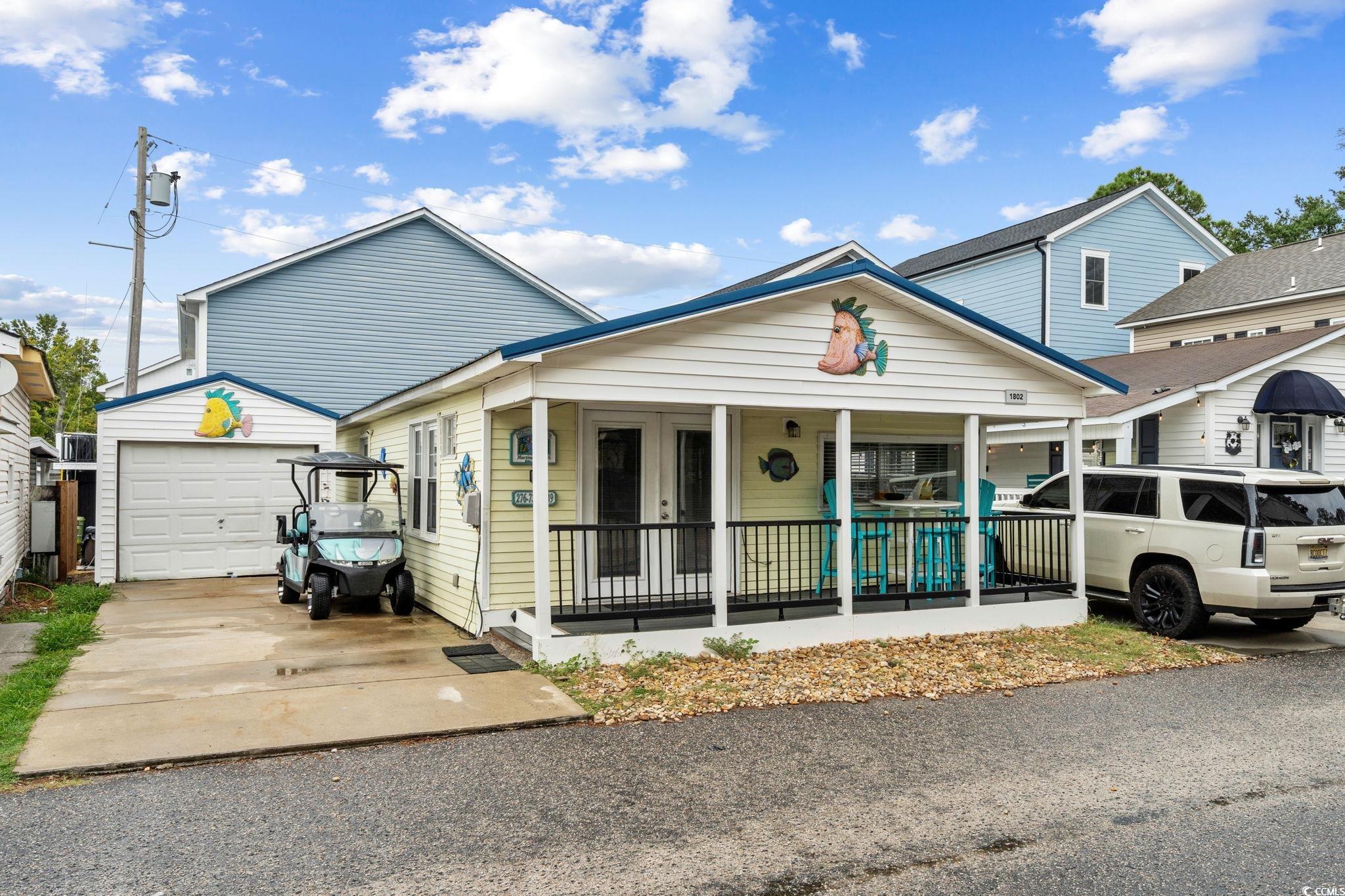 Image 2: View of front of property featuring a garage, cove