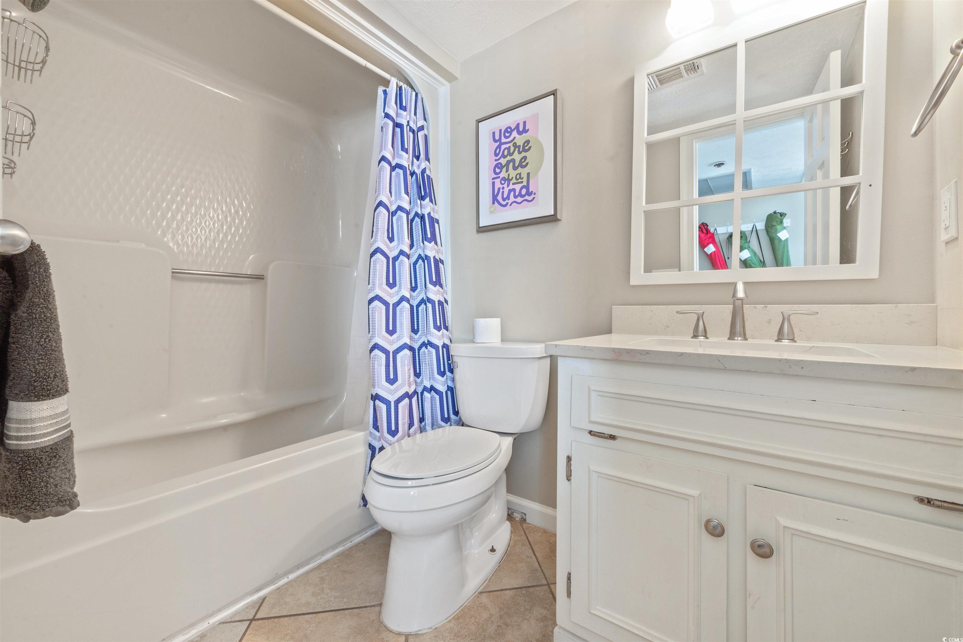Image 3: Bathroom featuring vanity, shower / tub combo, and Image 3: Bathroom featuring vanity, shower / tub combo, and