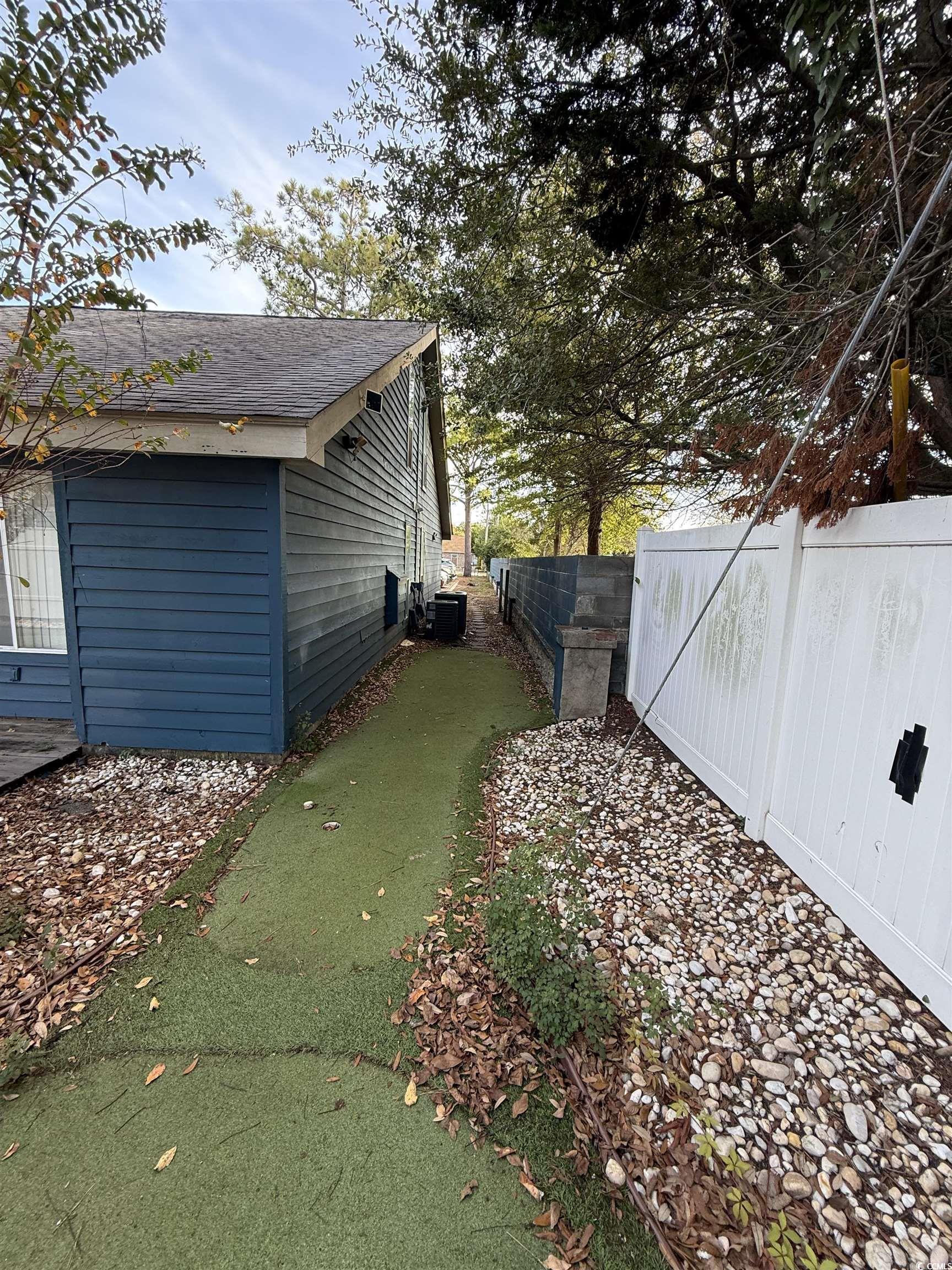 Image 4: View of side of property featuring roof with shing Image 4: View of side of property featuring roof with shing