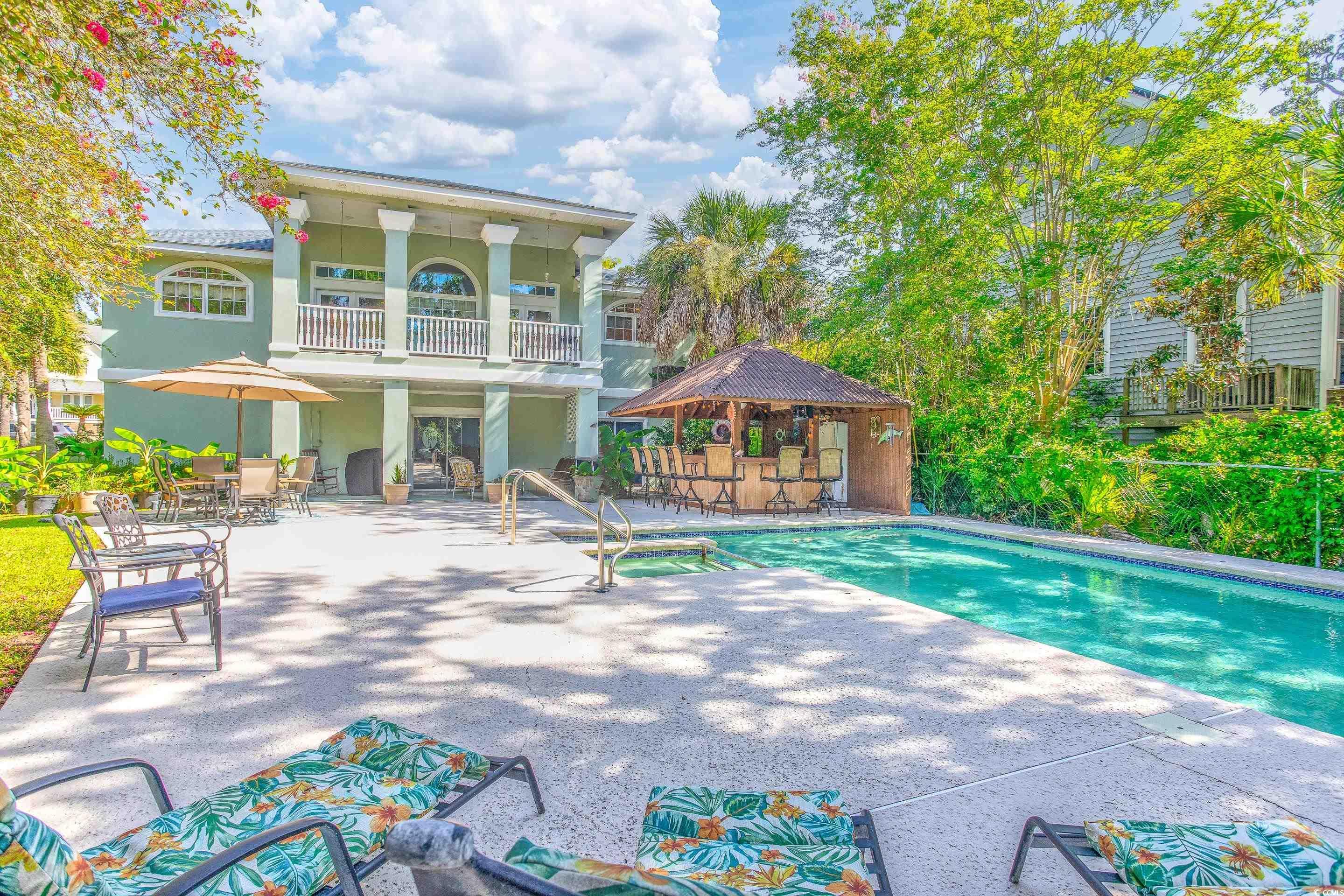 Image 1: View of pool with a patio area and a pool with con Image 1: View of pool with a patio area and a pool with con