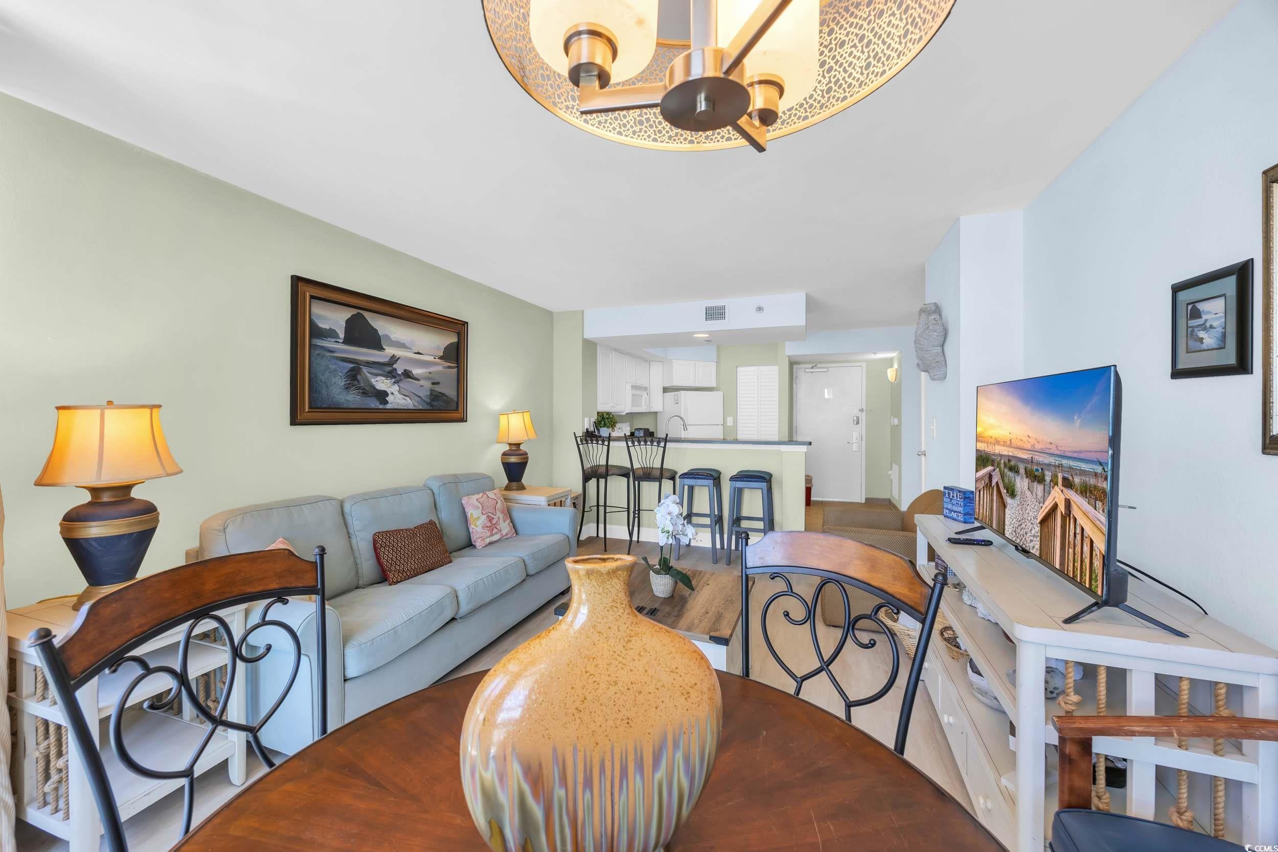 Image 4: Living area featuring wood finished floors and a c