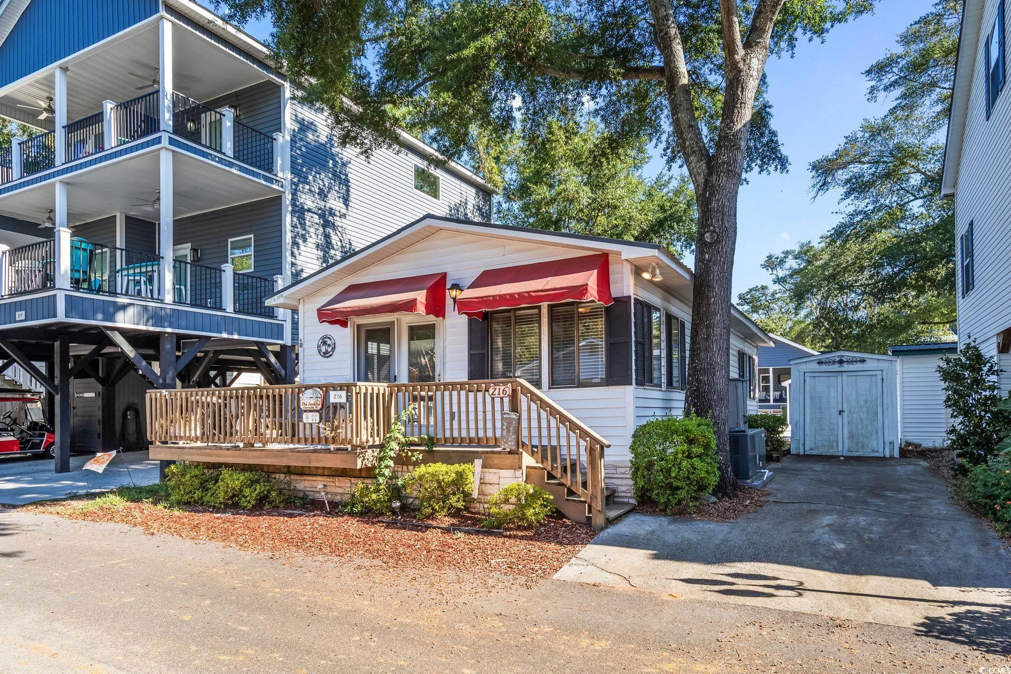 Image 3: View of front of house with a shed Image 3: View of front of house with a shed