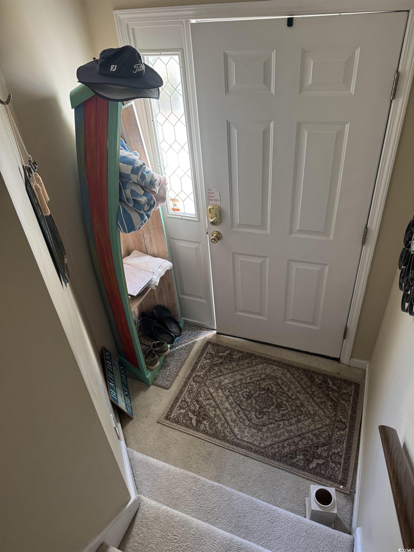 Image 3: Doorway to outside featuring carpet Image 3: Doorway to outside featuring carpet