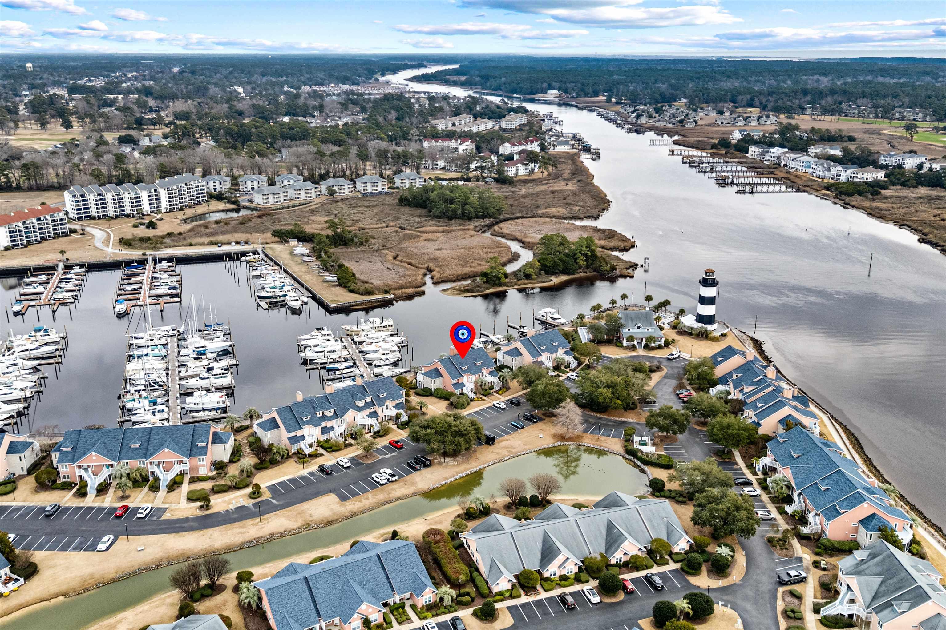 Image 2: Aerial view of property's location with a large bo