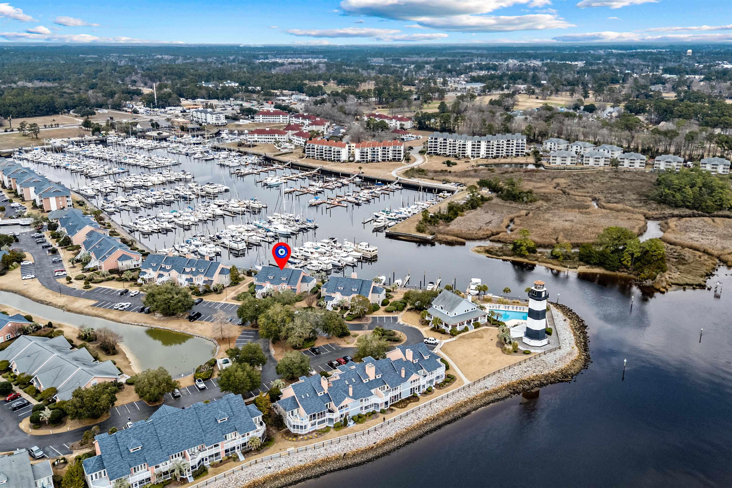 Image 3: Aerial view of a nearby body of water and a marina