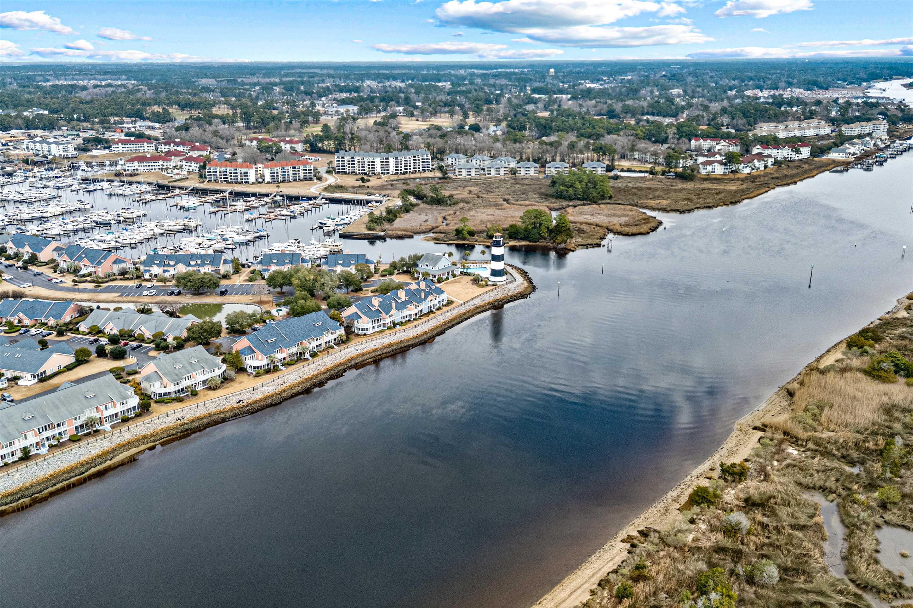 Image 4: Aerial view of a nearby body of water and a marina