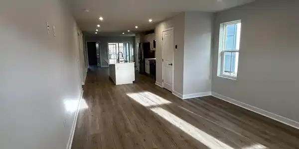 Image 2: Unfurnished living room with dark wood-style floor Image 2: Unfurnished living room with dark wood-style floor