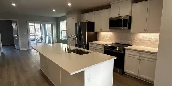 Image 3: Kitchen featuring a center island with sink, elect Image 3: Kitchen featuring a center island with sink, elect