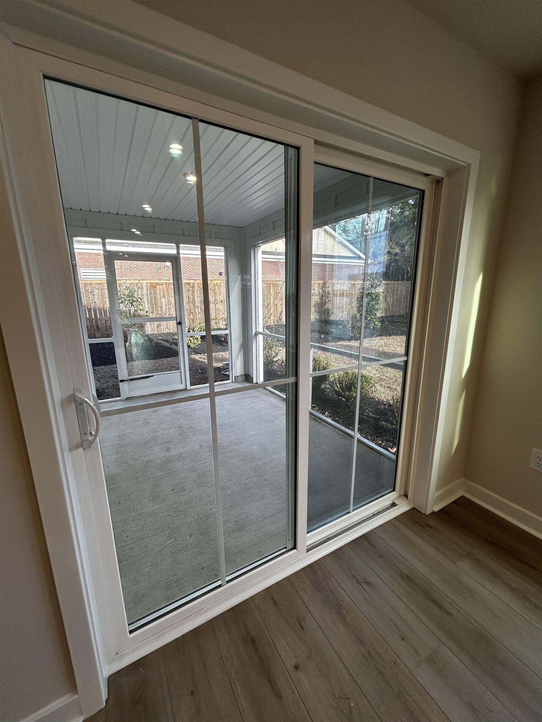 Image 4: Entryway with baseboards and wood finished floors Image 4: Entryway with baseboards and wood finished floors