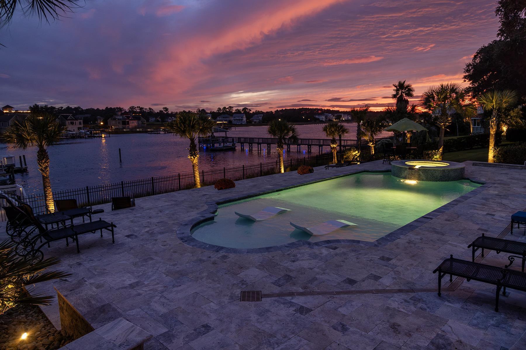 Image 2: View of pool featuring a patio, a pool with connec