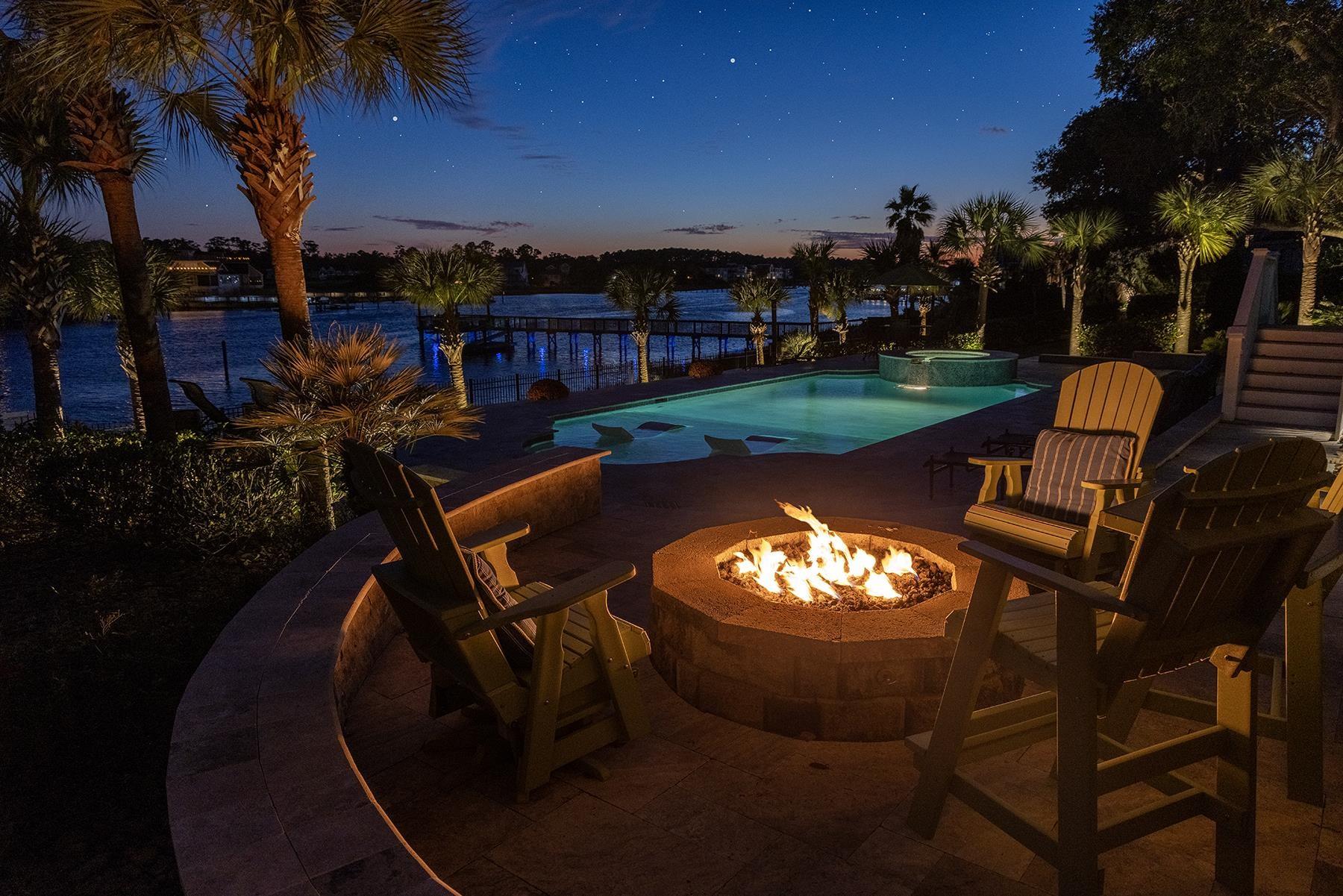 Image 3: View of swimming pool with a patio area, a pool wi
