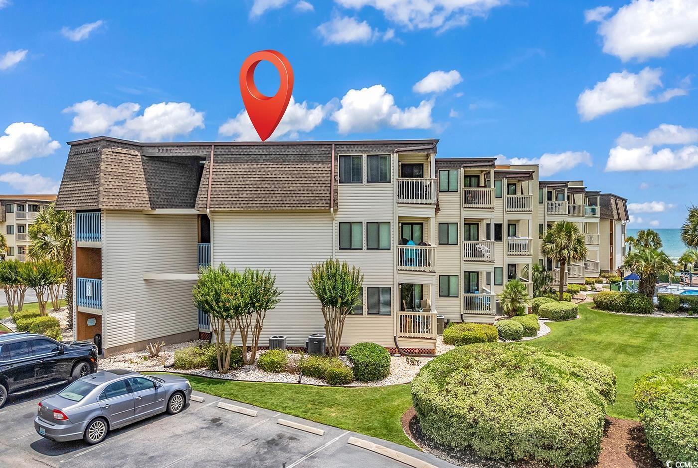 Image 1: View of apartment building / complex with uncovere Image 1: View of apartment building / complex with uncovere
