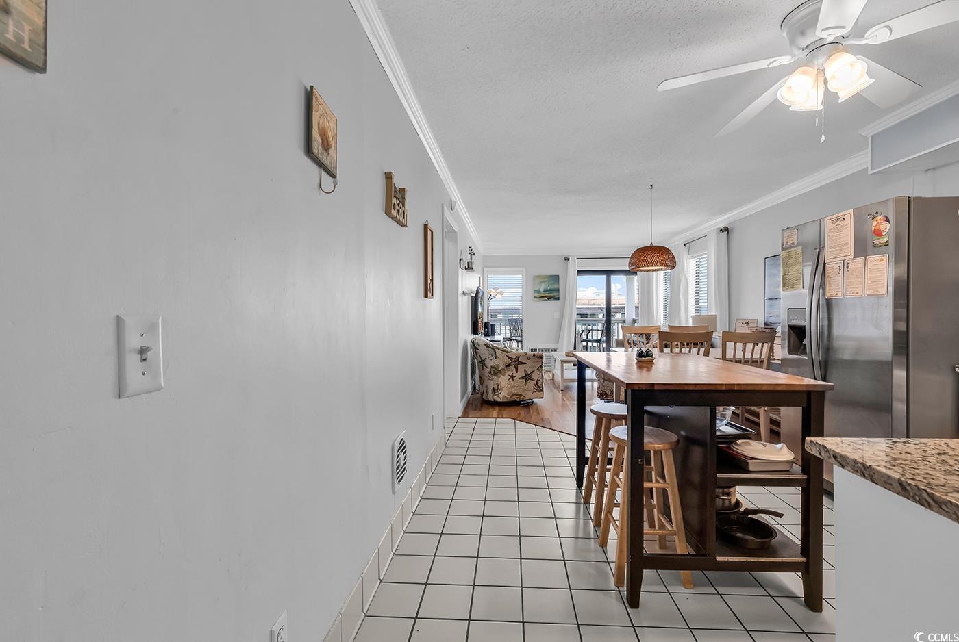 Image 2: Dining space featuring ornamental molding, ceiling Image 2: Dining space featuring ornamental molding, ceiling