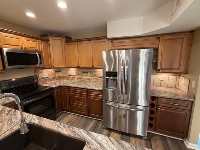 Image 3: Kitchen featuring decorative backsplash, appliance