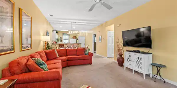 Image 4: Living area with a textured ceiling, carpet floors Image 4: Living area with a textured ceiling, carpet floors