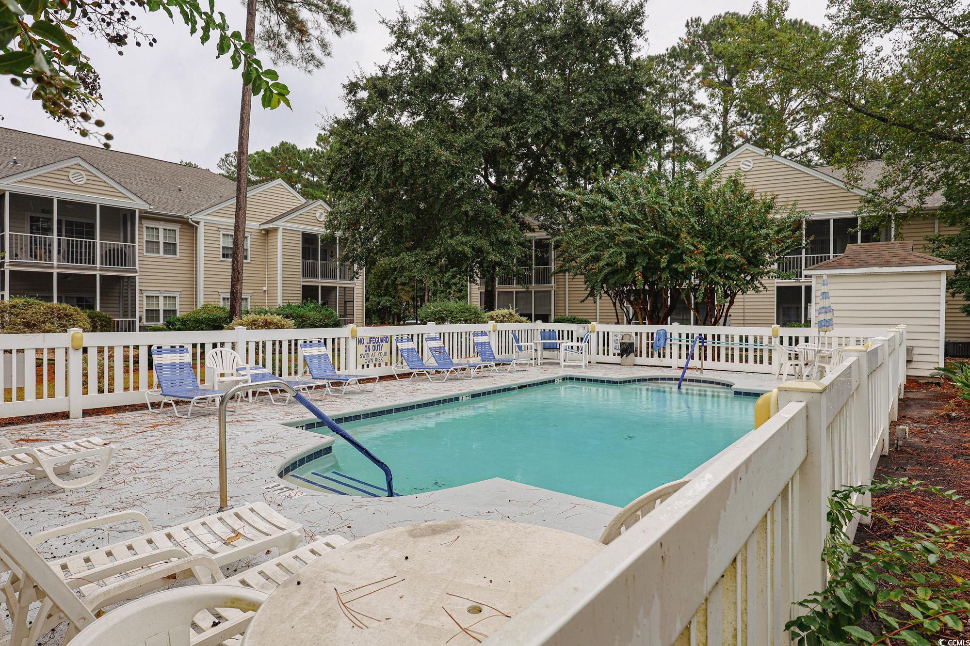 Image 2: Community pool featuring a patio Image 2: Community pool featuring a patio