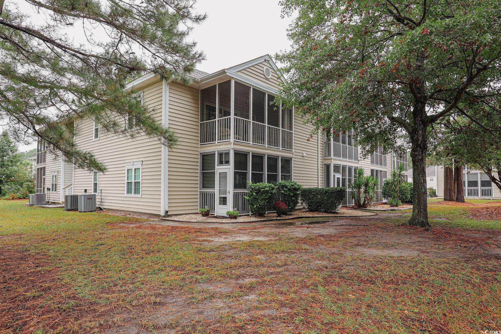Image 3: Rear view of property with a sunroom, a balcony, a Image 3: Rear view of property with a sunroom, a balcony, a