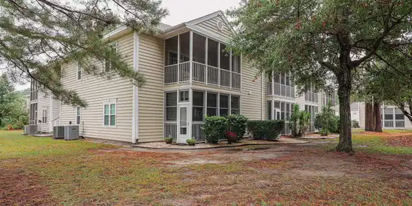 Image 3: Rear view of property with a sunroom, a balcony, a Image 3: Rear view of property with a sunroom, a balcony, a