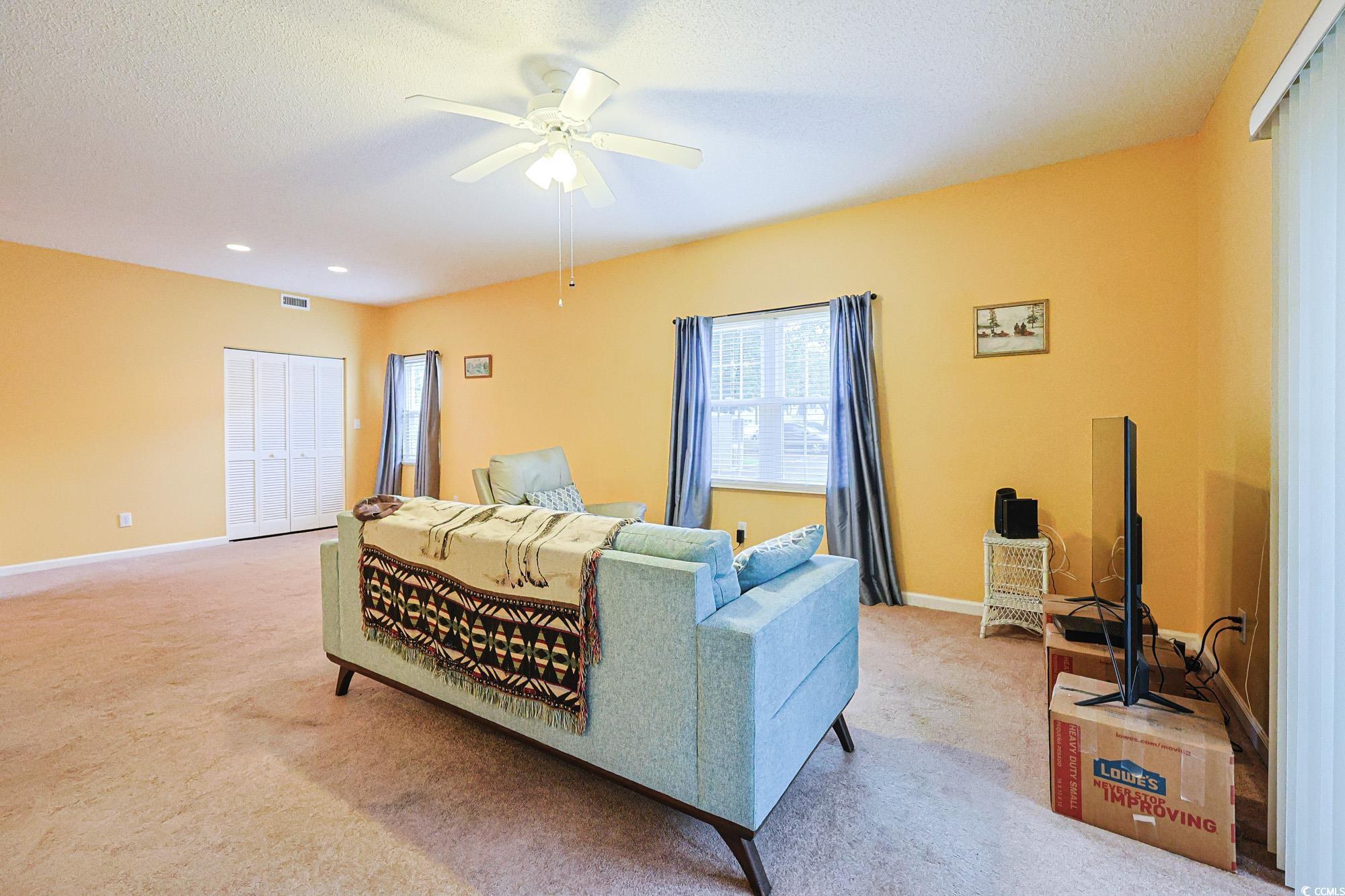 Image 4: Living area with light carpet, a textured ceiling, Image 4: Living area with light carpet, a textured ceiling,