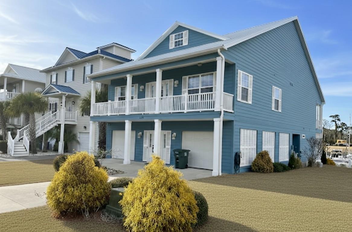 Image 2: Beach home with covered porch, a front yard, drive Image 2: Beach home with covered porch, a front yard, drive