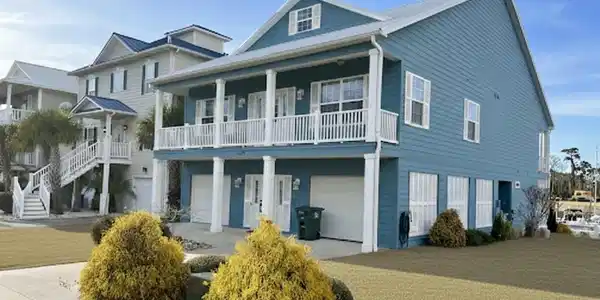 Image 2: Beach home with covered porch, a front yard, drive Image 2: Beach home with covered porch, a front yard, drive
