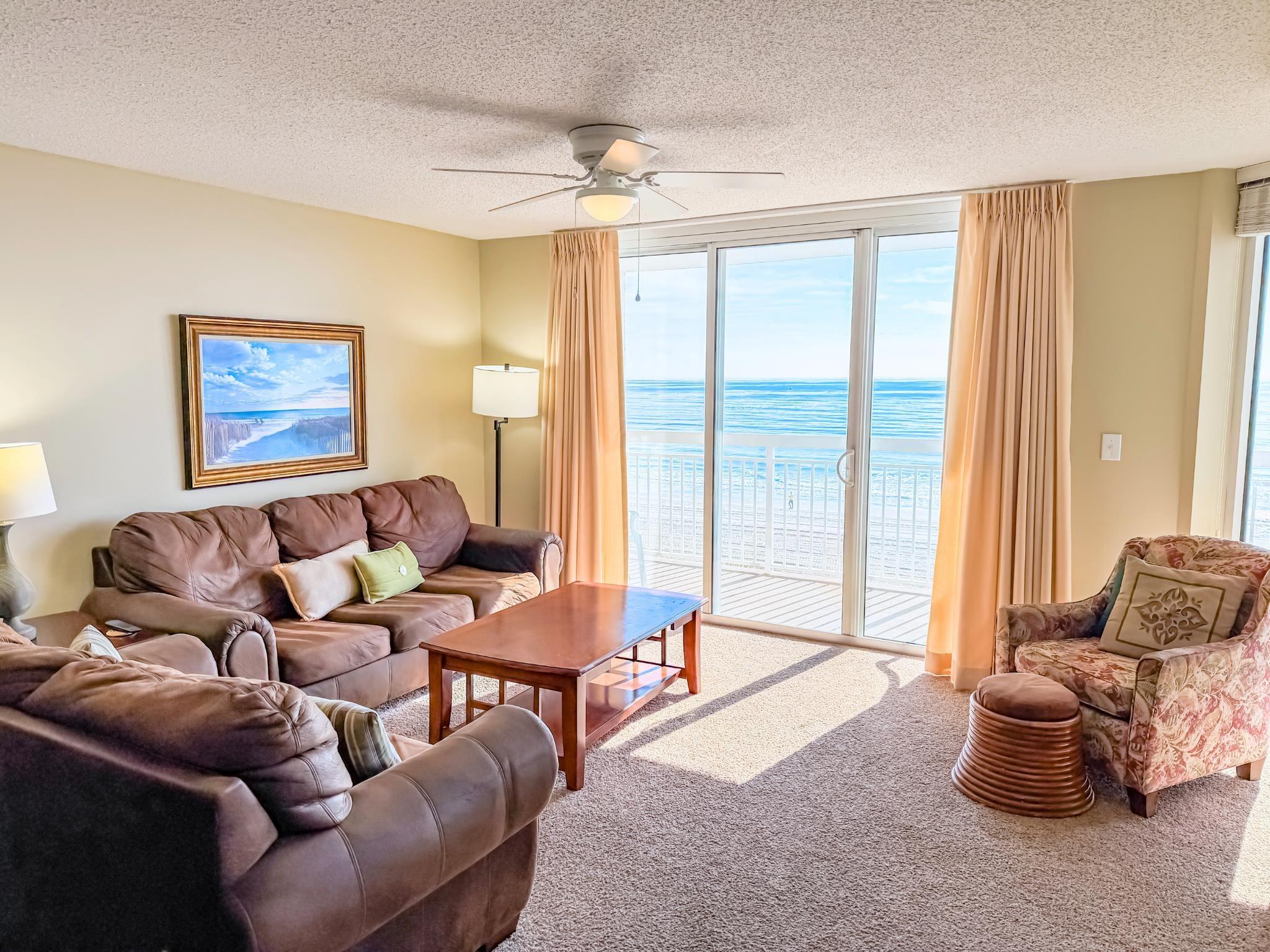 Image 2: Living area featuring ceiling fan, expansive windo Image 2: Living area featuring ceiling fan, expansive windo