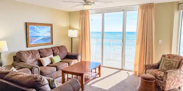Image 2: Living area featuring ceiling fan, expansive windo Image 2: Living area featuring ceiling fan, expansive windo