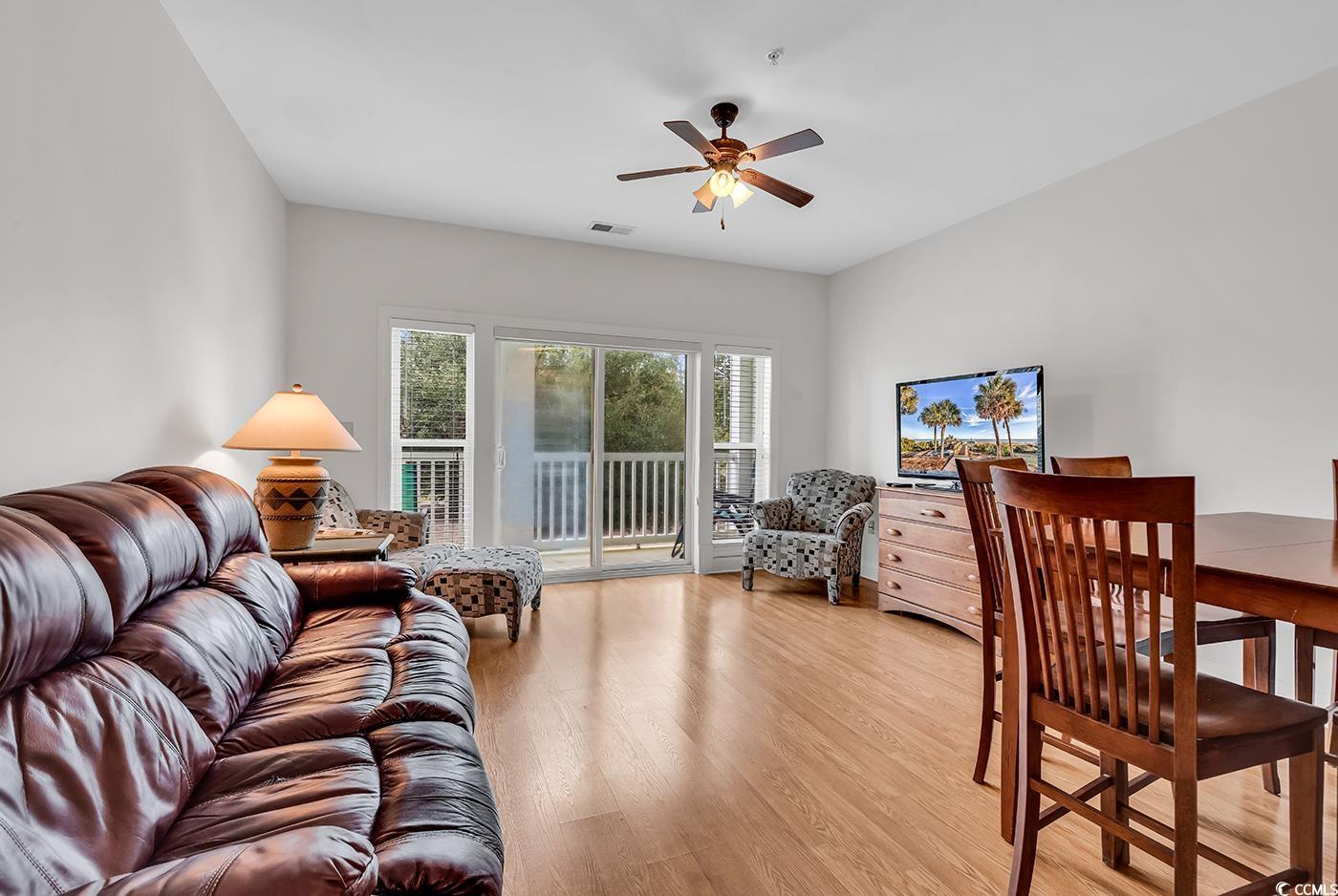 Image 2: Living room featuring light wood-type flooring and