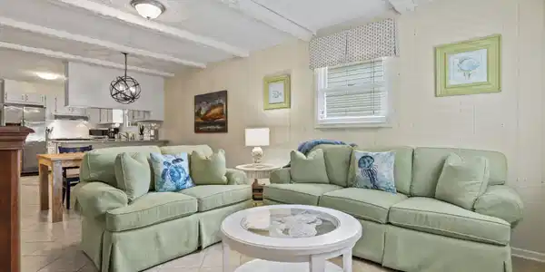 Image 3: Living area featuring light tile patterned floorin