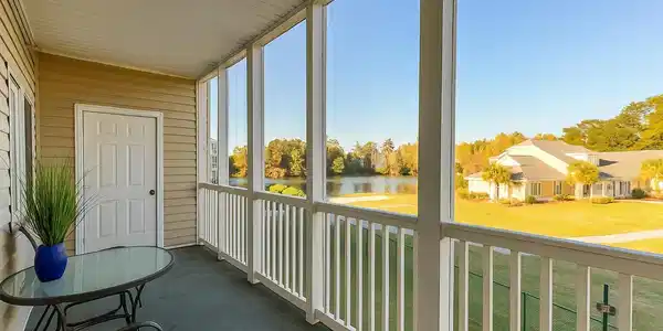 Image 3: Screened Porch with water views of the Pond and In Image 3: Screened Porch with water views of the Pond and In