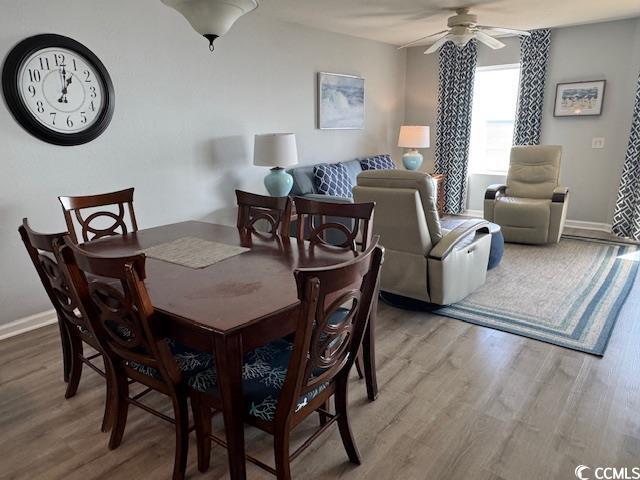 Image 4: Dining room with light wood-style flooring and a c Image 4: Dining room with light wood-style flooring and a c